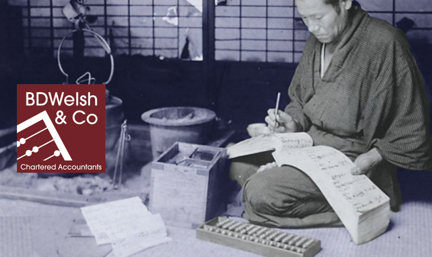 Traditional accountant writing besides logo